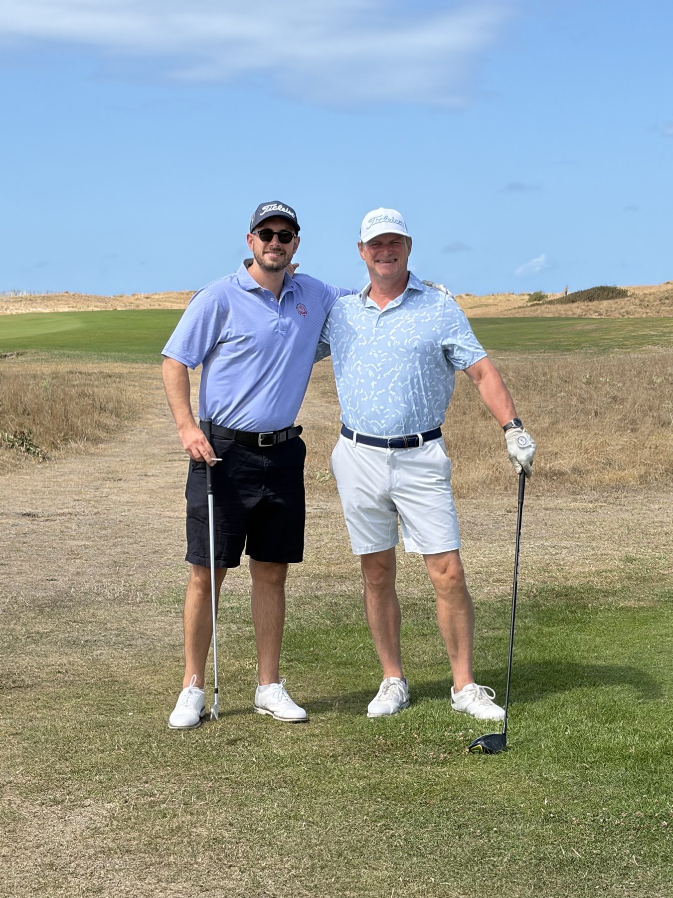 Andrew and his son Henri on the links at Granville Golf Club