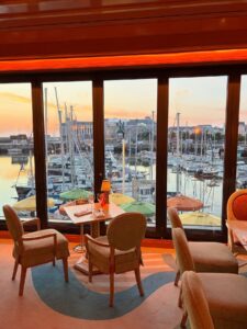 Le Deauville restaurant overlooking Deauville marina at sunset