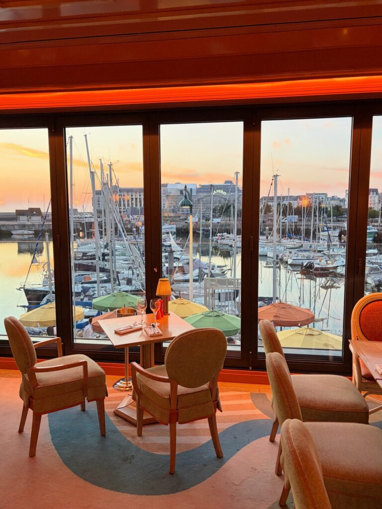 Le Deauville restaurant overlooking Deauville marina at sunset