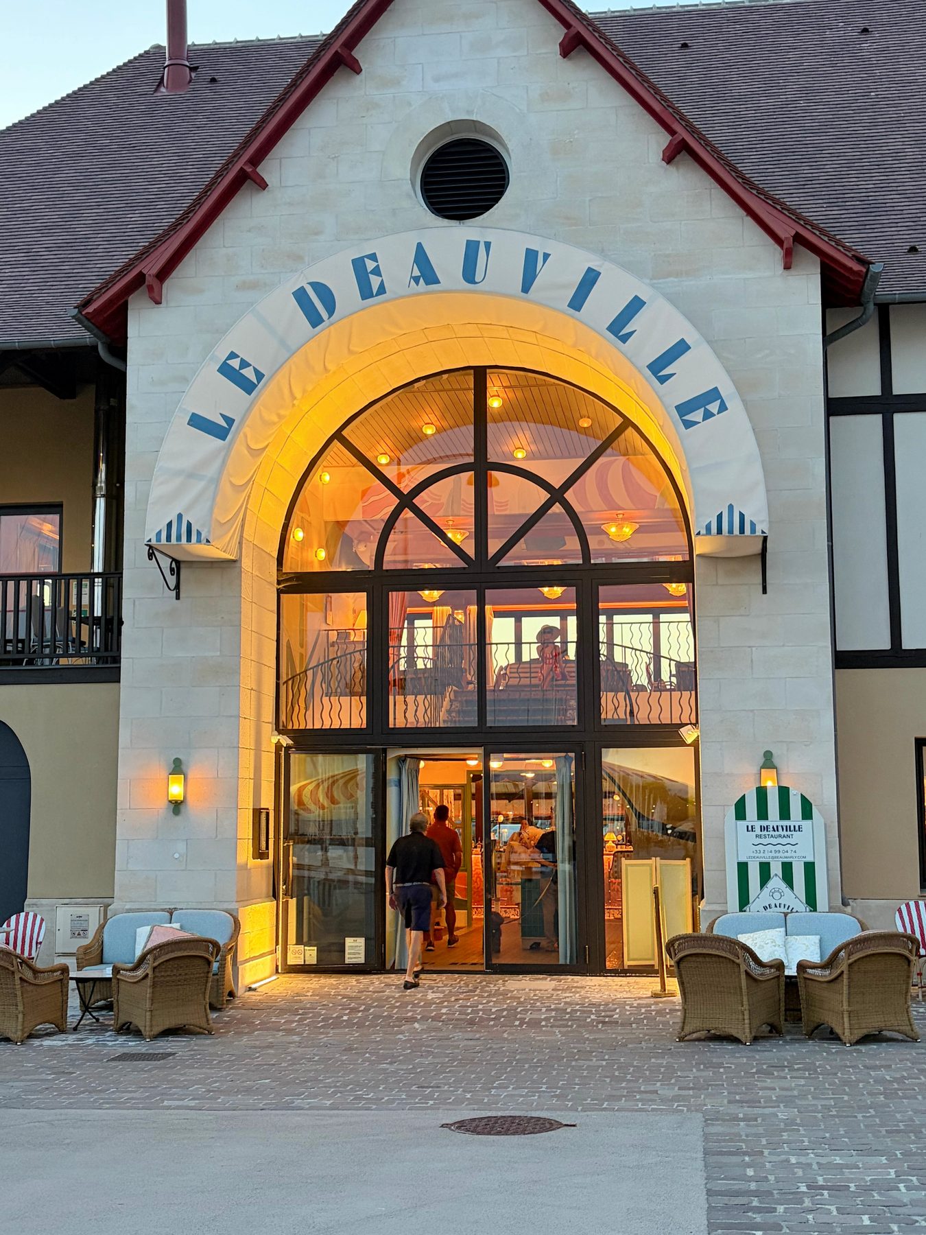 Entrance to Le Deauville restaurant at dusk