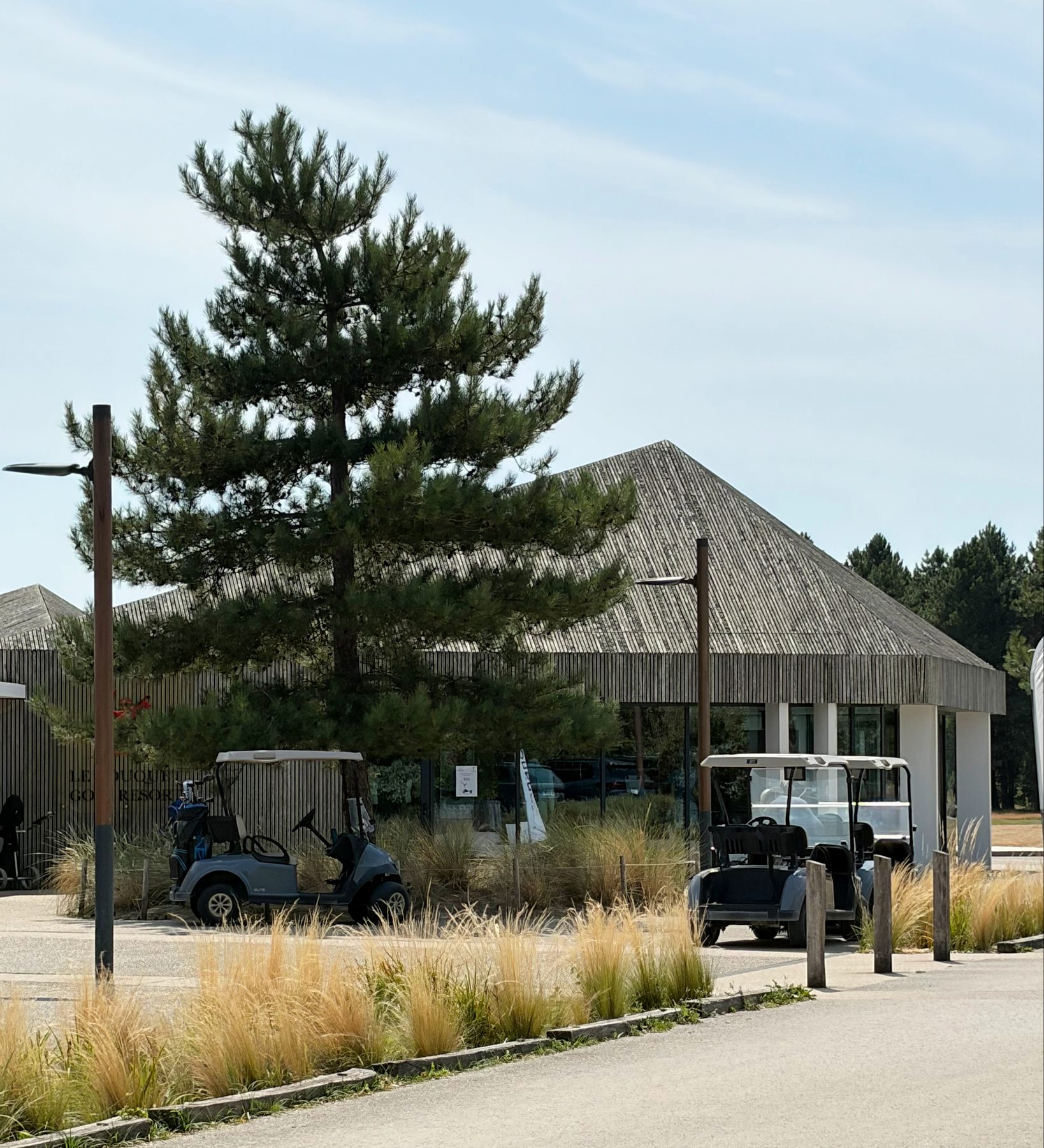 Le Touquet Golf Resort clubhouse with golf buggies